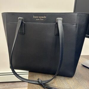 Carry your laptop to work in a beautiful Kate Spade bag.